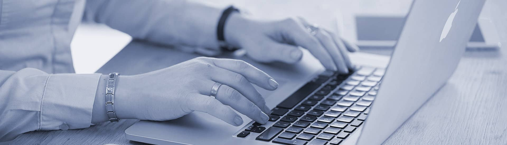 Services - a person sitting at a laptop computer